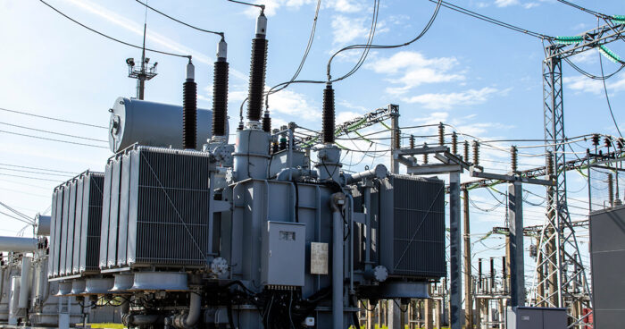 Power Transformer in operation against a blue sky.