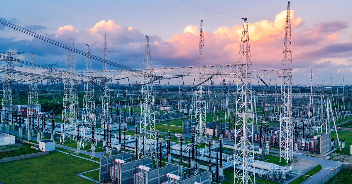 Fenced substation with transformers and transmission infrastructure, highlighting uptime and reliability in grid-connected renewable generation.